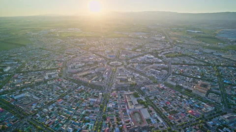 High-Angle Aerial Panoramic View of Tekes Bagua City at Golden Sunset Stock Footage 343586286