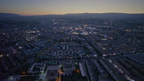 High-Angle Aerial Panoramic View of Tekes Bagua City Nightscape at Dusk Stock Footage 343586455