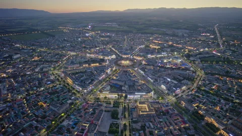 High-Angle Aerial Panoramic View of Tekes Bagua City Nightscape at Dusk Stock Footage 343586728