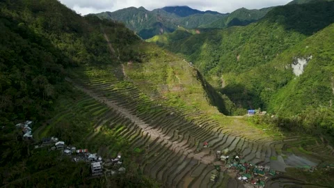 High Angle Aerial Parallax Above Batad Rice Terraces Banaue with Cordillera Stock Footage 335209997