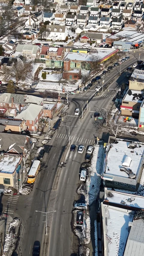 High angle aerial perspective flying over a bustling city street on a sunny Vídeos de archivo 331087237