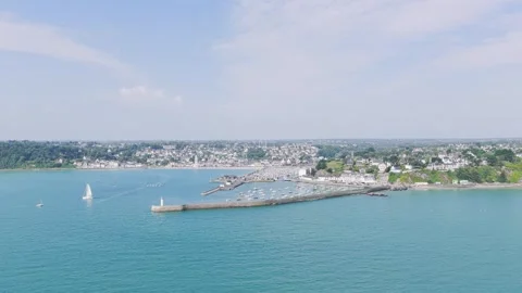 A high-angle aerial shot captures the picturesque coastal town and port of Binic Stock Footage 346666878