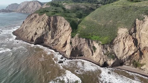 High-angle aerial shot capturing the dramatic meeting of rugged earth and sea Video stock 331976702