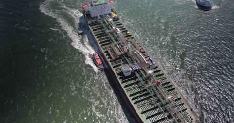 High Angle aerial shot of a cargo ship &amp; a pilot boat. Stock Footage 182891789