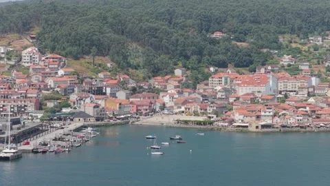 A high-angle aerial shot of the coastal village of Combarro, Spain, showing its Stock Footage 346721086