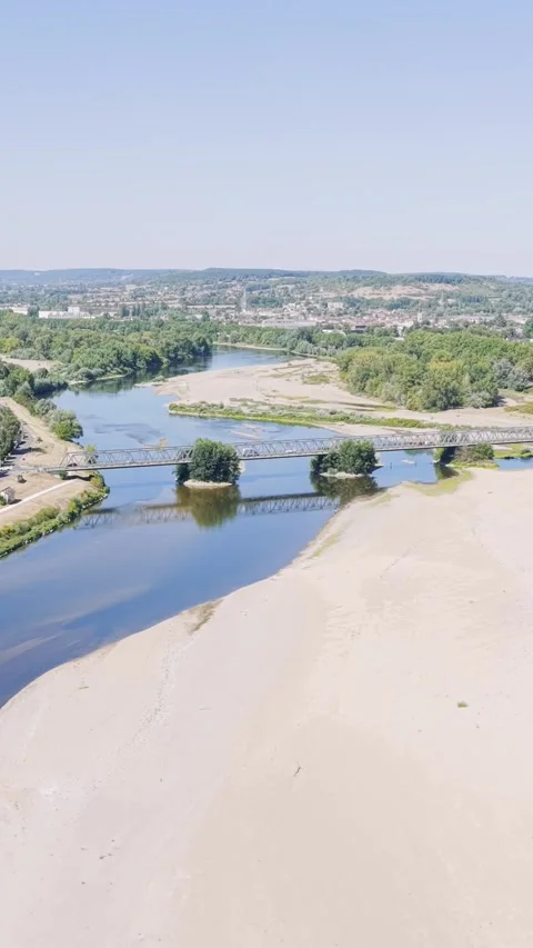 A high-angle aerial shot of the Fourchambault bridge spanning the Loire River in Stock Footage 346663712