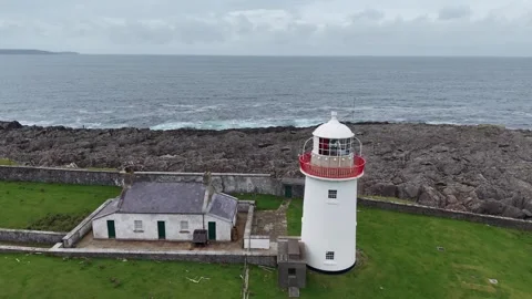 High-angle aerial shot of the historic white lighthouse tower, Ballyglass Stock Footage 342734604