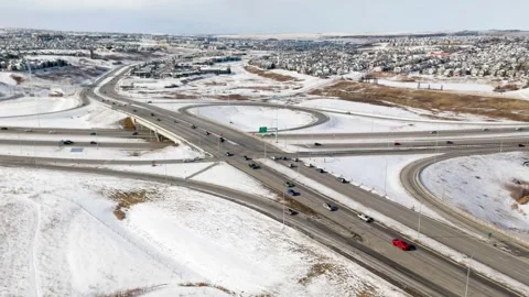 High-angle aerial time-lapse of a highway interchange with cars moving through Stock Footage 330827200