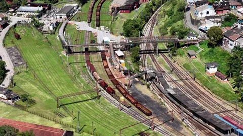 High-Angle Aerial Tracking Shot of Locomotive at Paranapiacaba Railway Yard Video stock 344908644