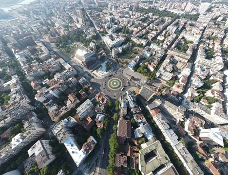 High-angle aerial view of Belgrade's cityscape featuring a central roundabout. Stock Photos