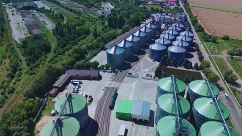 High angle aerial view of big grain storage facility with silver silos Stock Footage 341285670