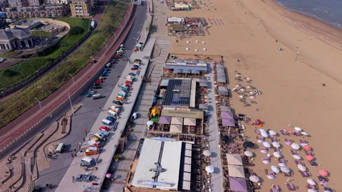 High-angle aerial view of a busy coastal beach resort featuring Video stock 337911216