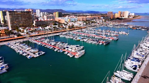 High angle aerial view of a coastal marina and beach Video stock 330492561