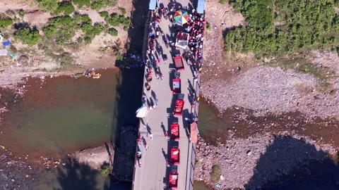 High angle aerial view of the Dajabón border bridge crossing Stock Footage 328834704