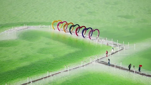 High-Angle Aerial View of Heart-Shaped Landmark at Mangya Emerald Lake Stock Footage 343795540