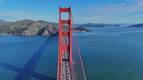 A high-angle aerial view of the iconic Golden Gate Bridge spanning the entrance Video stock 337824911