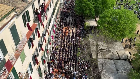 High angle aerial view of a large marching band parade during Greek Orthodox Video stock 333819737