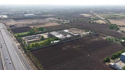 High Angle Aerial View of Large Scale Infrastructure Project Adjacent to Highway Stock Footage 340301336