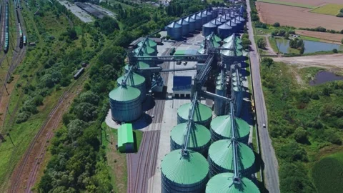 High angle aerial view of large industrial grain elevator complex Stock Footage 341284851
