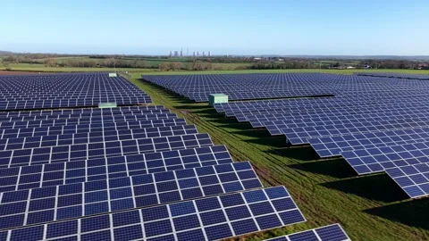High angle aerial view of a large photovoltaic solar farm array illuminated in Video stock 342080918