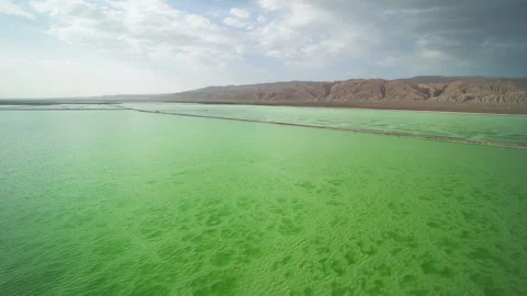 High-Angle Aerial View of Mangya Emerald Lake and Altun Mountains Hero Ridge 動画素材 343796560