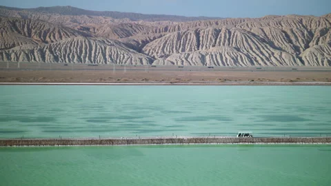 High-Angle Aerial View of Mangya Emerald Lake and Altun Mountains Hero Ridge Stock Footage 343796656