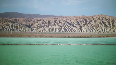 High-Angle Aerial View of Mangya Emerald Lake and Altun Mountains Hero Ridge Stock Footage 343796909