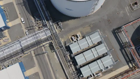 High angle aerial view of massive industrial liquid storage tanks Stock Footage 346706904