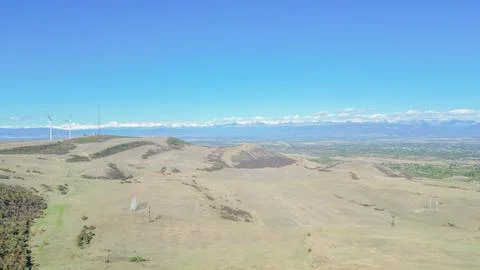 High angle aerial view of modern wind turbines farm on dry mountain hill fo.. Фото
