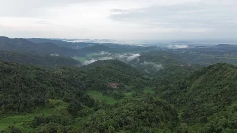 High-Angle Aerial View of Mountain Ranges and Forested Valleys Stock Footage 343858478