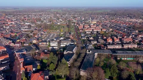 High angle aerial view of a peaceful Dutch town featuring traditional red Stock Footage 329801515