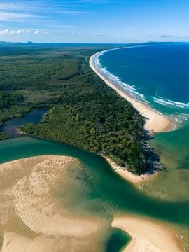 High-Angle Aerial View of River Estuary Meeting Turquoise Ocean Coastline Stock Photos