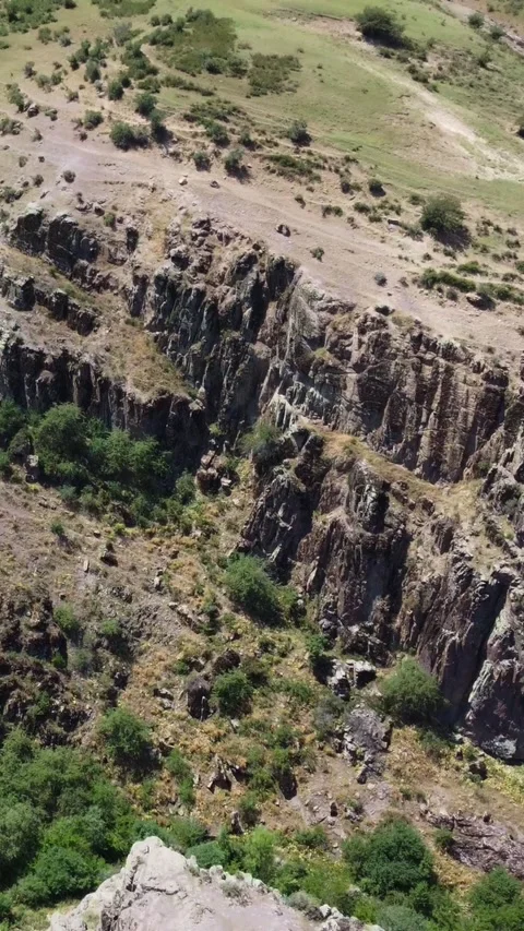 High angle aerial view of rugged basalt cliffs and steep ravines in Kazakhstan Stock Footage 338125183