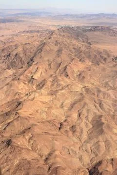 High Angle Aerial View of Rugged Desert Canyon and Eroded Terrain Stock Photos