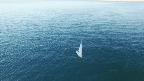 High angle aerial view of sail yacht sailing at open sea. Stock Footage 108468723