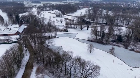 High-angle aerial view of a serene winter landscape with a winding river 스톡 동영상 330751723