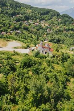 High angle aerial view of sunken tilted church building in abandoned Ropoto.. Stock Photos