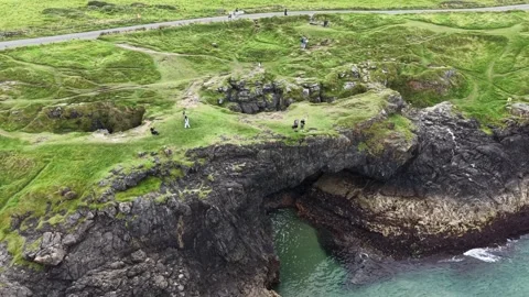 High angle aerial view of tourists walking along Fairy Bridge, Ireland. Stock Footage 342718532