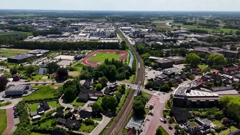 High angle aerial view of train passing through dutch landscape 스톡 동영상 336594857