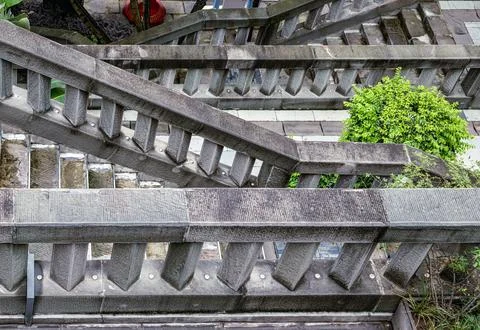 High-angle architectural abstract of interlocking stone staircases, severe .. Foto stock