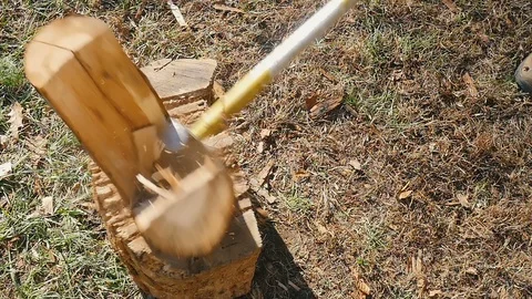 High Angle of an Ax Chopping Timber into Firewood in Slow Motion Stock Footage