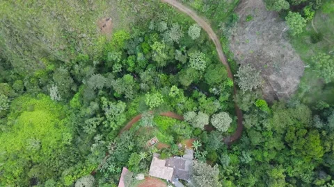A High Angle bird's eye view of houses on a mountain range Stock Footage 165176538