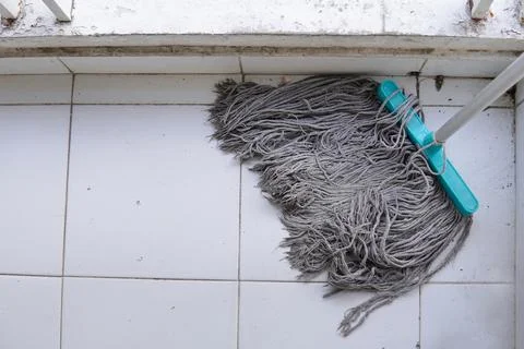 The high angle bottom part of the mop is occurring on the wall texture. Too.. Stock Photos