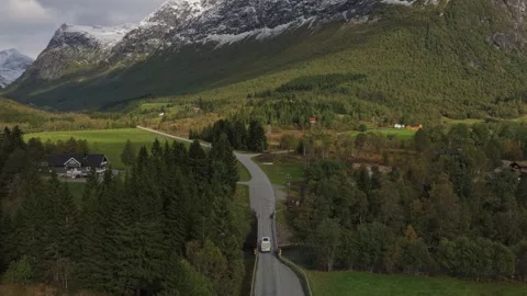 High angle capture of camper on road in dramatic Norway scenery Stock Footage 320950991