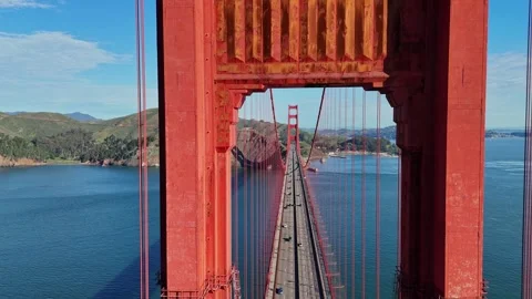 A high-angle, centered shot looking through the iconic red towers of the Golden 스톡 동영상 337824985