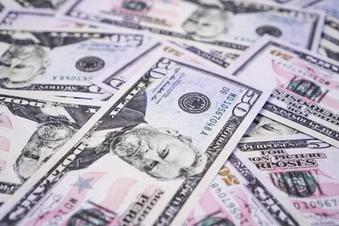 A high angle close up background shot of multiple United States fifty dolla.. Stock Photos