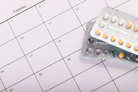 High angle close-up of blister packs of medicines on medication calendar, copy Stock Photos