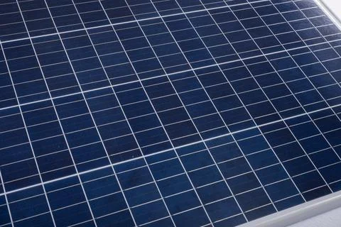 High angle close-up of blue solar panel with white grid pattern, copy space Stock Photos