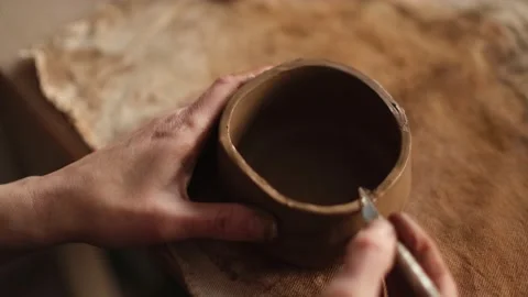 High angle close up of ceramic artist cuts clay for teapot in the studio Stock Footage 236372562