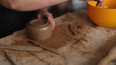 High angle close up of ceramist making ceramic teapot in the studio Stock Footage 236373459